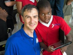 Food For The Poor donor John Marshall, left, first met Stevenson Joseph when he traveled to Haiti in 2013. Marshall traveled to Haiti in April 2014 to fit the prosthetic hand developed by RoboHand and visit with Stevenson. (Contributed)