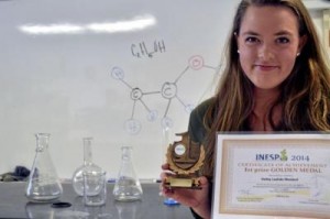 Hailey Loehde-Woolard, the Gold Medal winner of the International Environment Sustainability Project Olympiad, shows off her trophy and certificate on Monday. (photo credit: Emma Brokaw, Santa Cruz Sentinel)