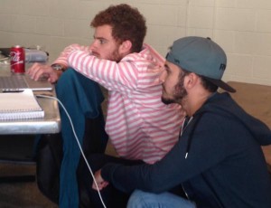 Members of the Pricing Right team put finishing touches on their presentation on Sunday. The team of Brazilian students proposed an app that would allow users to the scan bar codes of store items and compare the prices with those at nearby stores. (Photo credit: Jonathan Partridge)