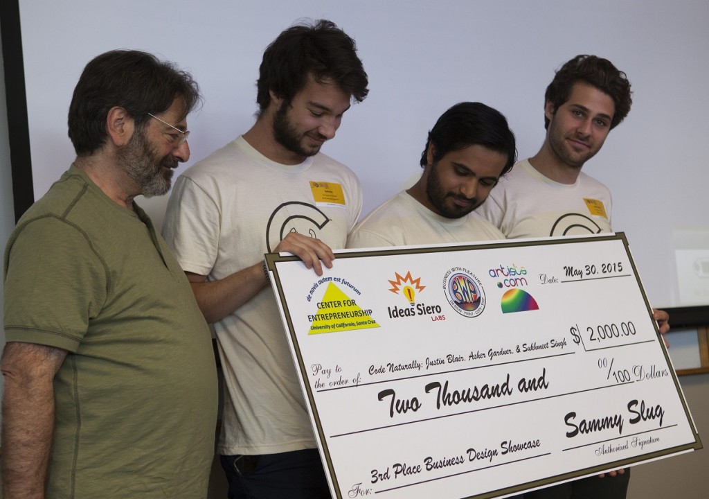 Left to right: Sponsor Marcelo Siero, owner of Ideas Siero Labs, artists.com, and Business With Pleasure (and a PhD student in computer engineering at UCSC), 3rd-Place Winners Justin Blair, Sukhmeet Singh, Asher Gardner of Code Naturally, a Microsoft Surface application for recognizing handwriting, compiling code, and executing it on the right half of the Surface screen. Credit: Tosh Tanaka. 