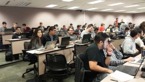 A packed room of students prepare for the start of a one unit course on quality software engineering. The course spanned two full Saturdays and was taught by Erik Eldridge, an engineer at Twitter. Contributed.