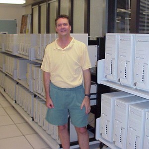 Haussler with the original Dell computer cluster used for the assembly of the first human genome. Contributed.