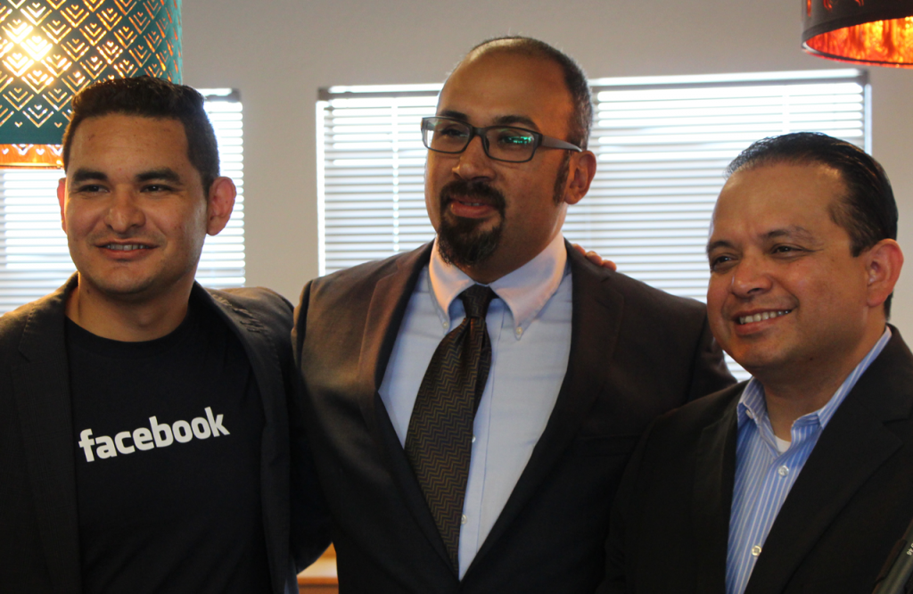 Juan Salazar, Facebook associate manager of state political outreach, Jacob Martinez, Digital NEST executive director, and Luis Alejo, California State Assemblyman shared a smile before the press conference announcing Facebook's donation of 25 new computers to multimedia training center Digital NEST. (Credit: Jan Janes)