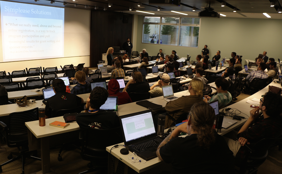Participants in CSUMB Hackathon Monterey Bay 2015 listened to Laura Harris present for Simplease Solutions at the Friday afternoon concept pitch session. (Credit: Jan Janes Media)