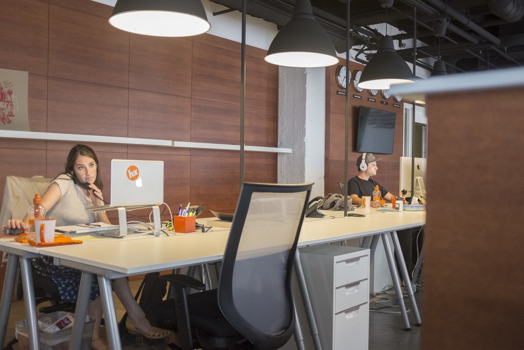 "In the zone..." Account Coordinator, Ali DeMoro (left) and Developer, Ryan Milano at work in the new HZDG office above Abbott Square. (Credit: Jules Henry-Rawls)