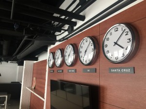 Clocks show the time in each location where HZ has an office. (Credit: Ted Holladay)