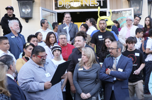 At the downtown opening of Digital NEST, Watsonville Mayor Felipe Hernandez presented the official city proclamation to Board Chair Michelle Bassi and Executive Director Jacob Martinez. (Credit: Jan Janes Media)