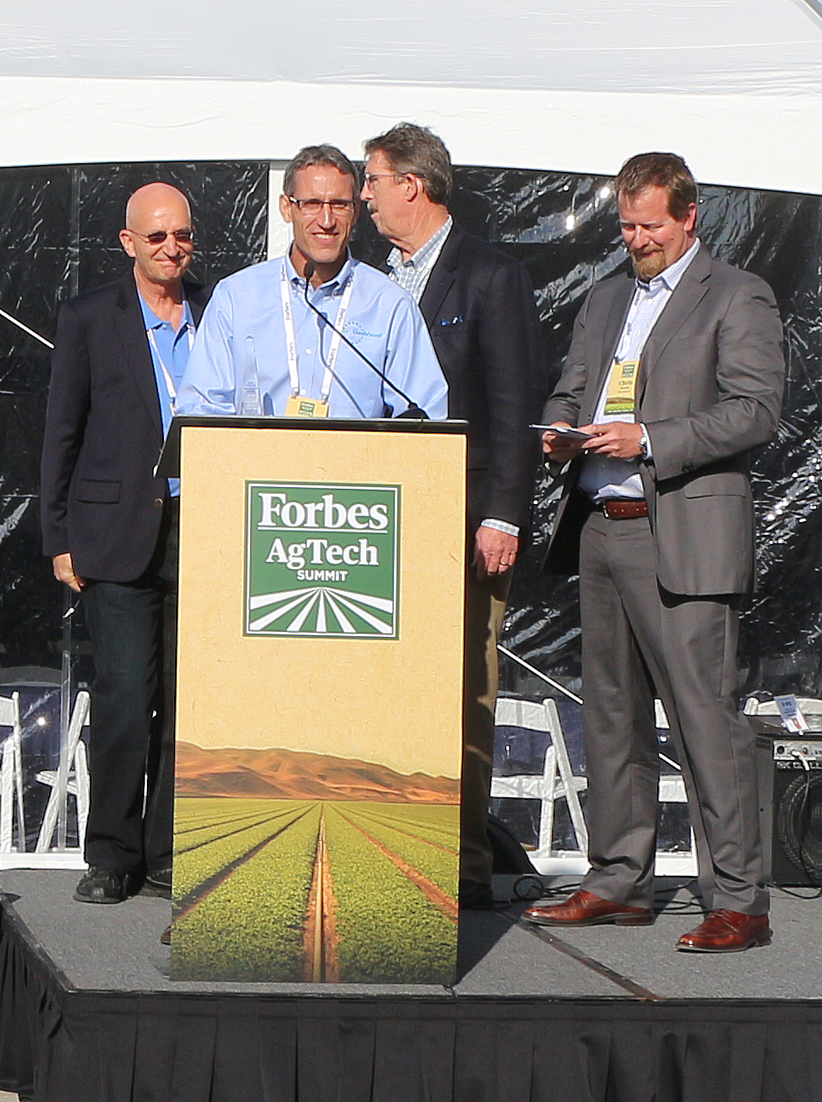 Carl Kalin and Jeffrey Orrey of GeoVisual Analytics received the Thrive Operational Excellence Award from Hank Gicles of WGA and Chris Boody of SVG. The competitive award was for the company's attainment of operations excellence across time, cost and quality. (Credit: Jan Janes Media)