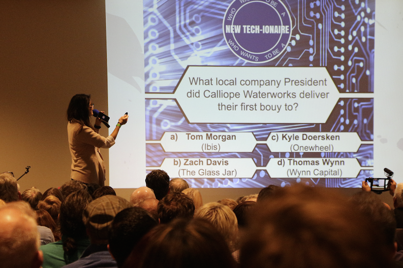 Looking to win smart watch wristbands, the audience played New Tech-ionaire along with Amanda Rotella, coordinator with the Santa Cruz Economic Development Department. Rotella runs a quiz game at the meetup each month based on news she finds in Santa Cruz Tech Beat.