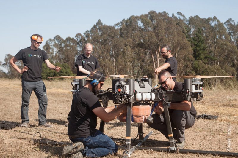 The Parallel Flight Technologies team mounts firehose to the heavy lift drone for a test flight